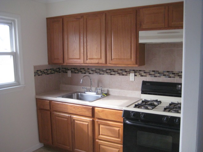 New kitchen with mosaic tile accent