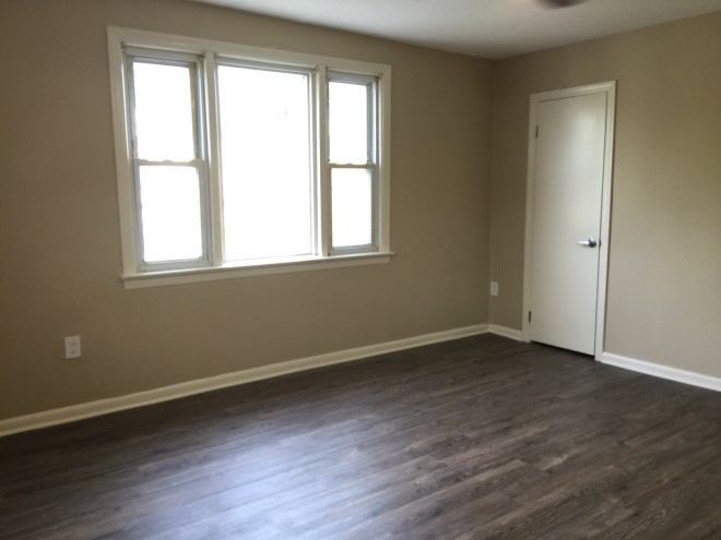 Living room with large window and closet