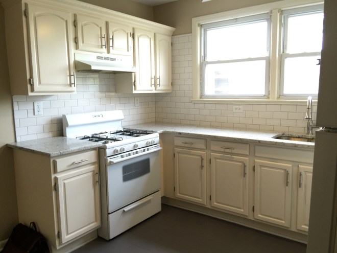 Bright Kitchen with subway tile and large windows